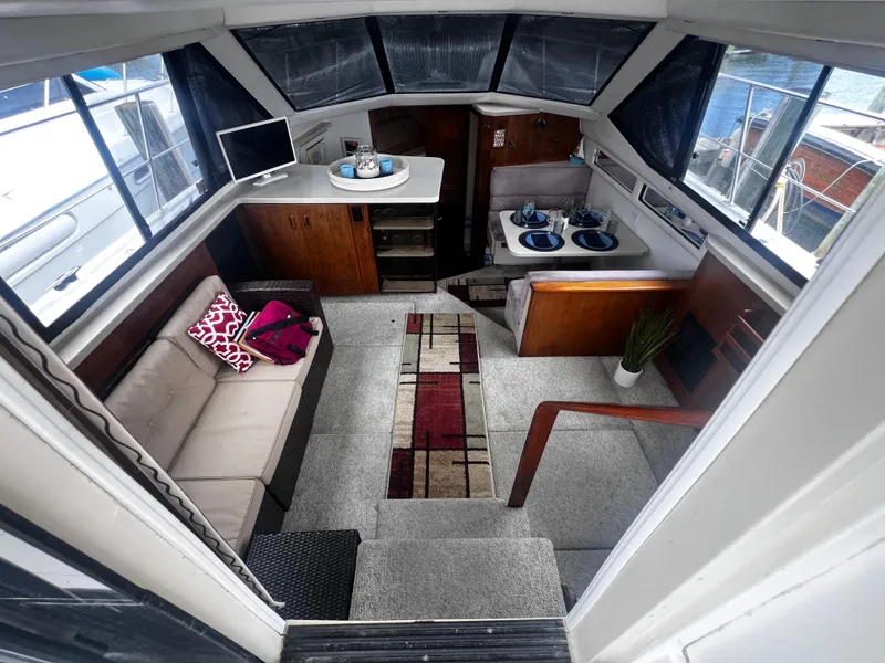 Slide: The Image of Interior of 1993 Carver 350 Aft Cabin yacht with cozy seating and dining area. - 18