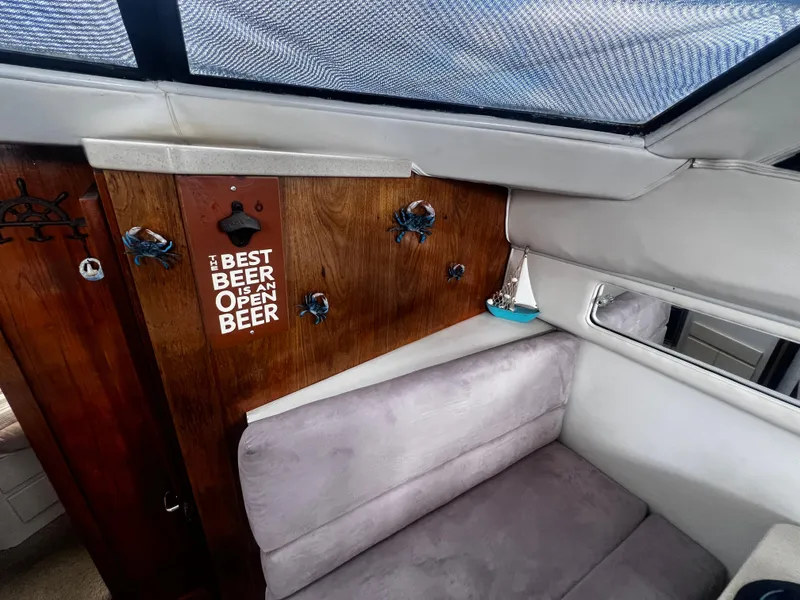 Slide: The Image of Interior of 1993 Carver 350 Aft Cabin with beer opener and nautical decor. - 25