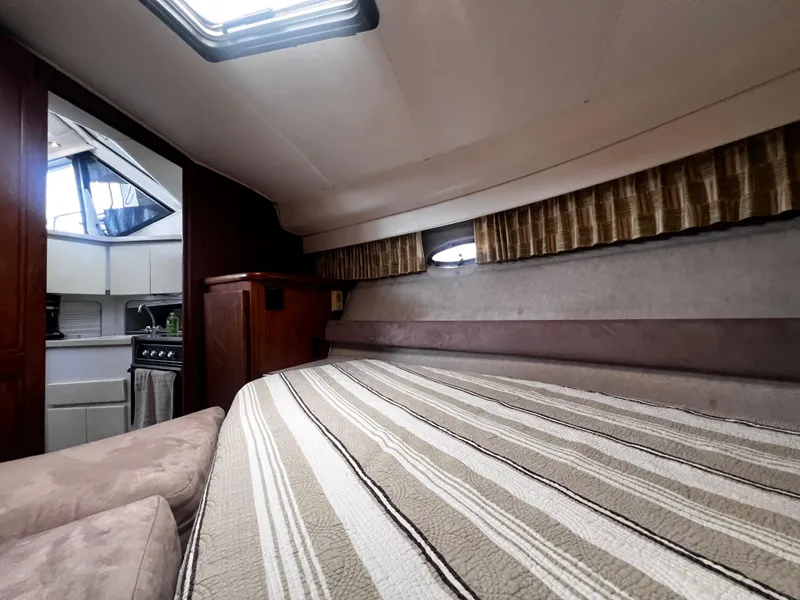 Slide: The Image of Interior of 1993 Carver 350 Aft Cabin with bed and kitchenette. - 35