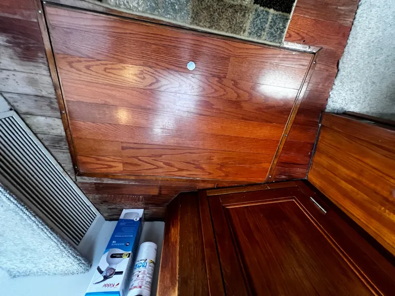 Slide: The Image of Interior of 1993 Carver 350 Aft Cabin with wooden paneling and storage compartments. - 37