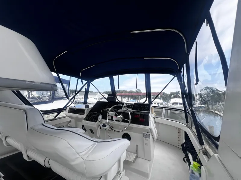 Slide: The Image of Interior view of 1993 Carver 350 Aft Cabin yacht helm station. - 6