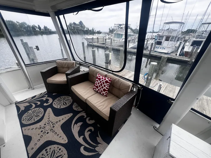 Slide: The Image of Interior of 1993 Carver 350 Aft Cabin yacht with marina view. - 7