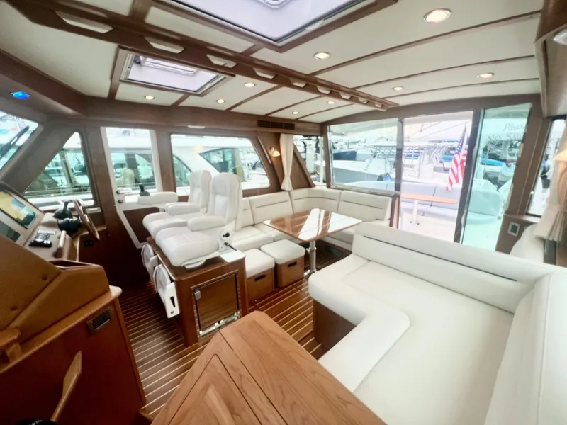 Slide: The Image of Luxurious interior of 2025 Sabre 48 Salon Express yacht with elegant seating and wood finishes. - 10