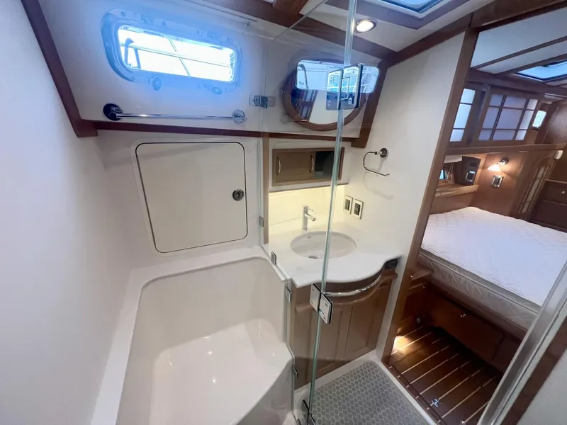 Slide: The Image of Luxurious bathroom interior of 2025 Sabre 48 Salon Express yacht, featuring modern amenities. - 19