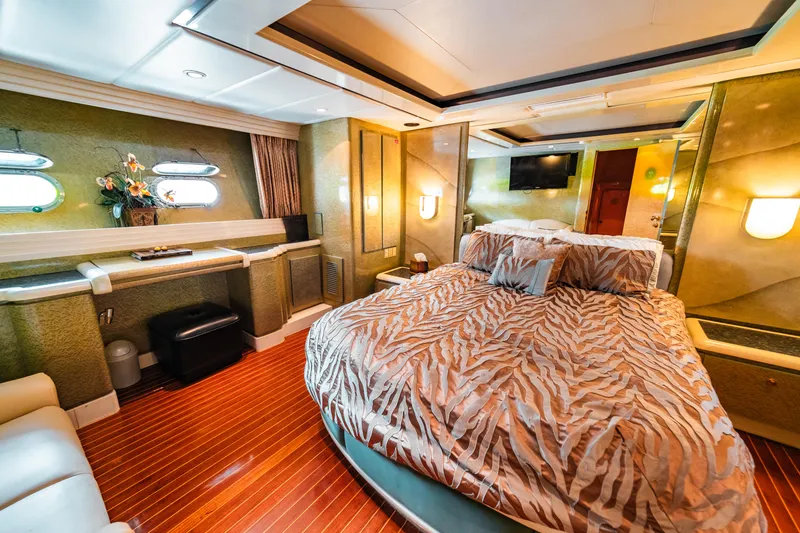 Slide: The Image of Luxurious master bedroom on a 1992 Monte Fino 94 Motor Yacht with elegant decor. - 15