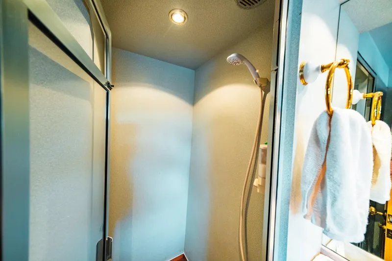 Slide: The Image of Shower area in 1992 Monte Fino 94 Motor Yacht with towels hanging. - 17