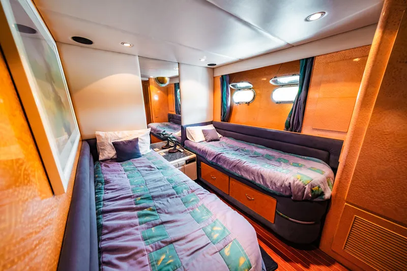 Slide: The Image of Twin bed cabin in a 1992 Monte Fino 94 Motor Yacht with modern decor. - 18