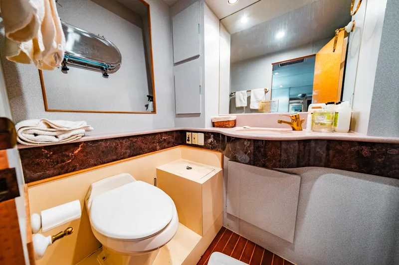 Slide: The Image of Luxurious bathroom in a 1992 Monte Fino 94 Motor Yacht with modern amenities. - 19