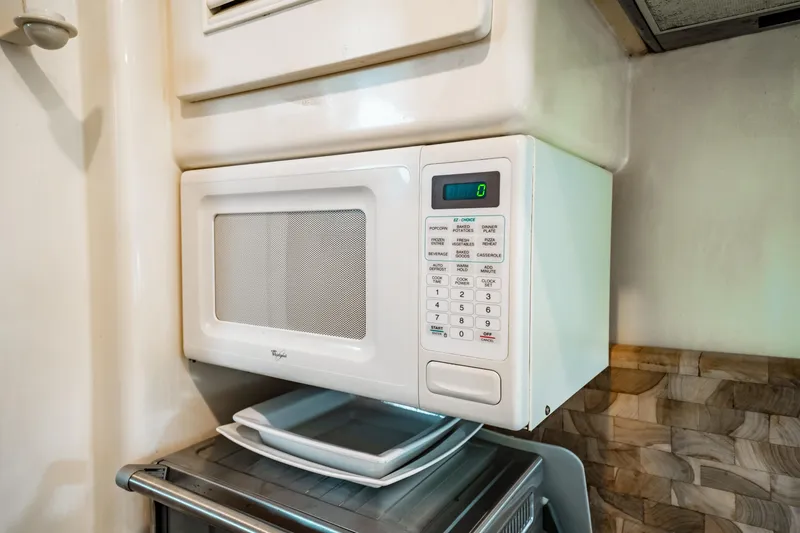 Slide: The Image of Microwave in the kitchen of a 1992 Monte Fino 94 Motor Yacht. - 28