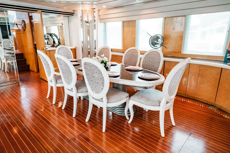 Slide: The Image of Elegant dining area on a 1992 Monte Fino 94 Motor Yacht with wooden flooring. - 34