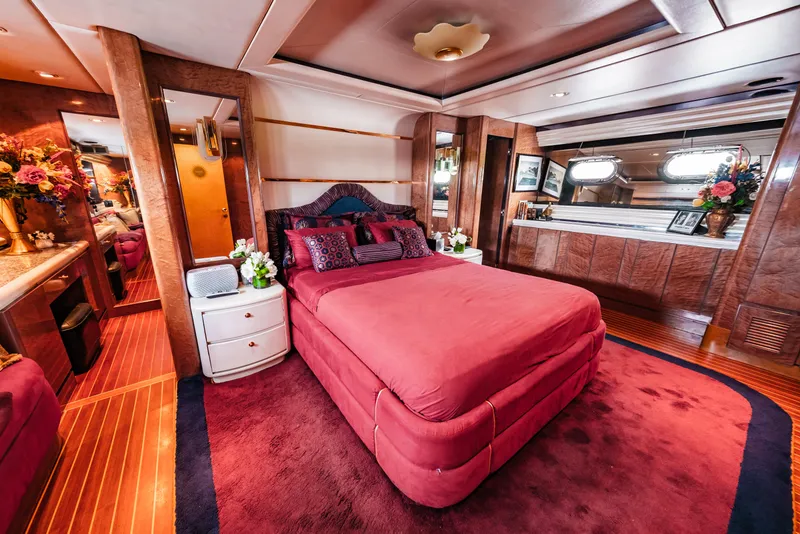 Slide: The Image of Luxurious master bedroom on a 1992 Monte Fino 94 Motor Yacht with red decor. - 37