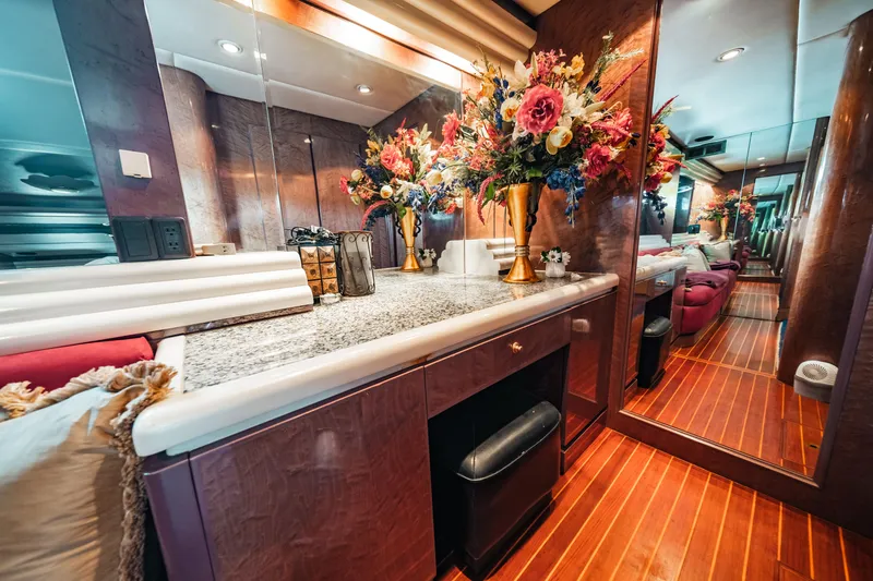 Slide: The Image of Luxurious interior of 1992 Monte Fino 94 Motor Yacht with elegant floral arrangement. - 38