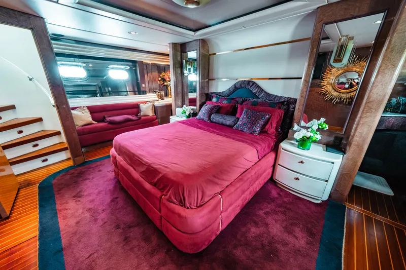 Slide: The Image of Luxurious master bedroom on 1992 Monte Fino 94 Motor Yacht with plush red bedding. - 39