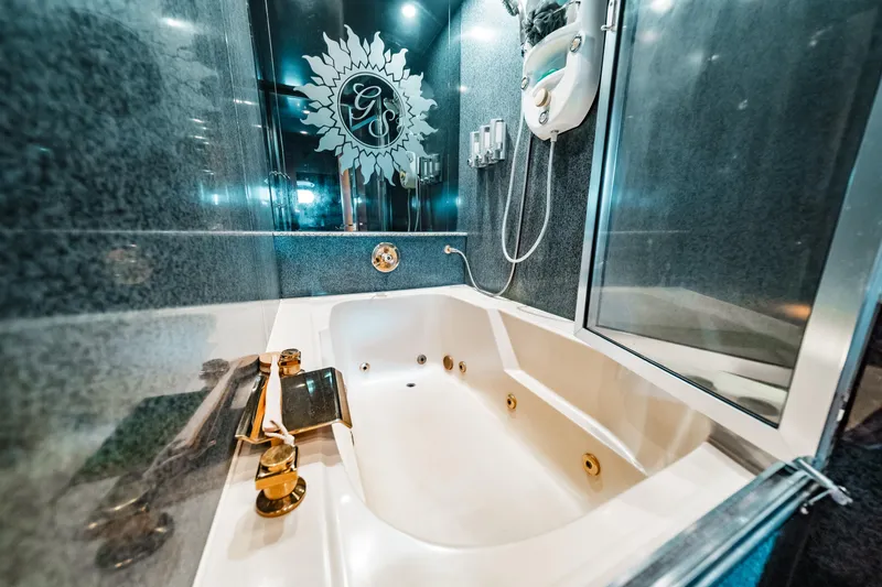 Slide: The Image of Luxurious bathroom with jacuzzi tub on 1992 Monte Fino 94 Motor Yacht. - 41