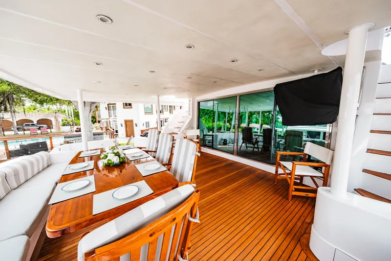 Slide: The Image of Spacious deck of 1992 Monte Fino 94 Motor Yacht with elegant dining area. - 45