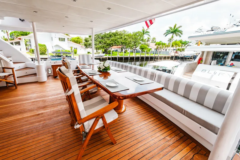 Slide: The Image of Monte Fino 94 Motor Yacht 1992 aft deck with dining table and seating. - 46