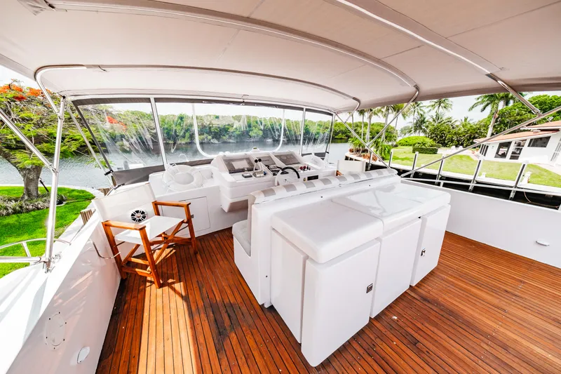 Slide: The Image of Monte Fino 94 Motor Yacht 1992 - spacious upper deck with seating and helm station. - 48