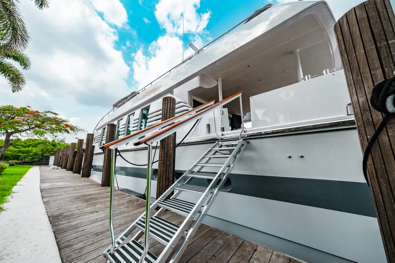Slide: The Image of Monte Fino 94 Motor Yacht 1992 docked with boarding ladder and wooden walkway. - 6