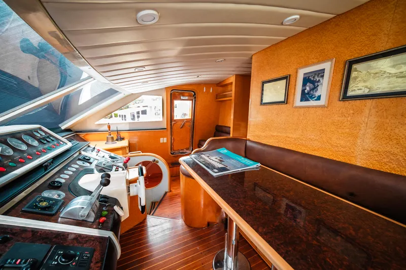 Slide: The Image of Interior of 1992 Monte Fino 94 Motor Yacht with helm station and seating area. - 7