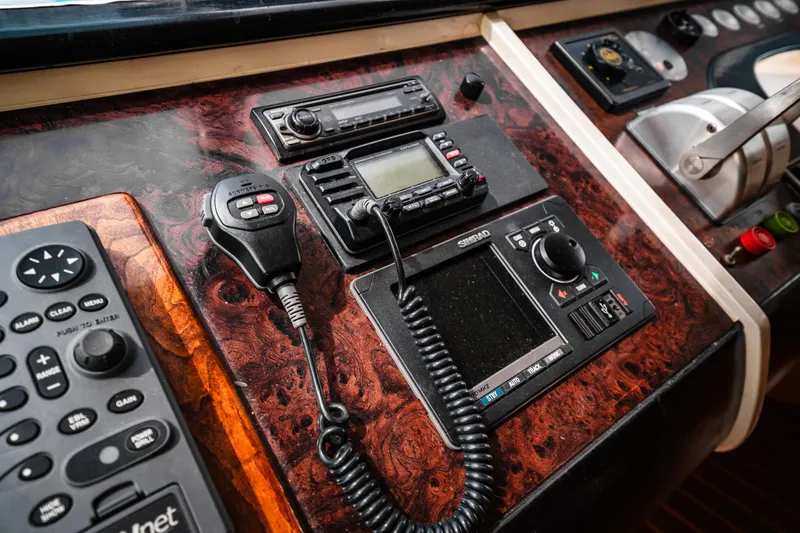 Slide: The Image of Control panel of a 1992 Monte Fino 94 Motor Yacht with communication devices. - 9