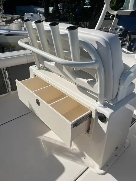 Slide: The Image of 2023 Sea Born LX24 Center Console LE with rod holders and storage drawer. - 6