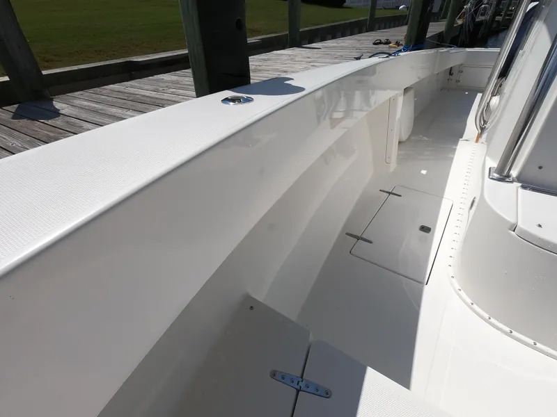 Slide: The Image of 2003 Venture 34 Open boat deck, clean and spacious with white finish. - 12