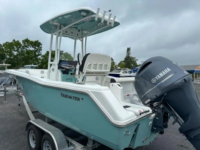 Slide: The Image of 2023 Tidewater 220 CC Adventure boat with Yamaha outboard motor on trailer. - 3