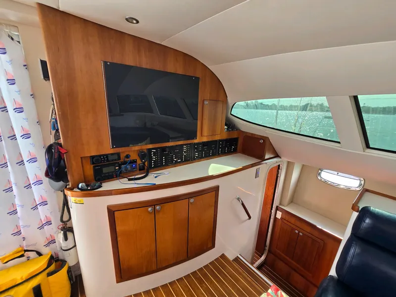 Slide: The Image of Interior of 2009 Fusion 40 boat with wooden cabinetry and control panel. - 10
