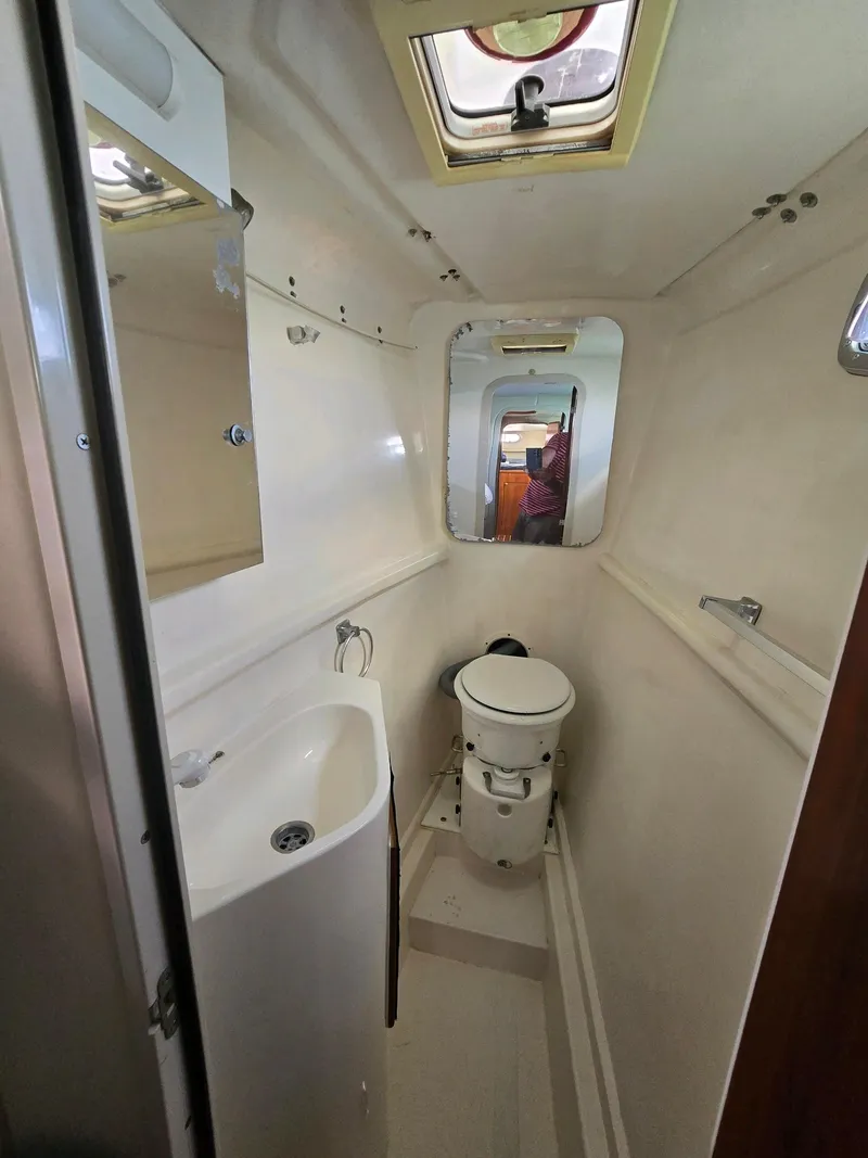 Slide: The Image of Compact bathroom in 2009 Fusion 40 boat with sink and toilet. - 17