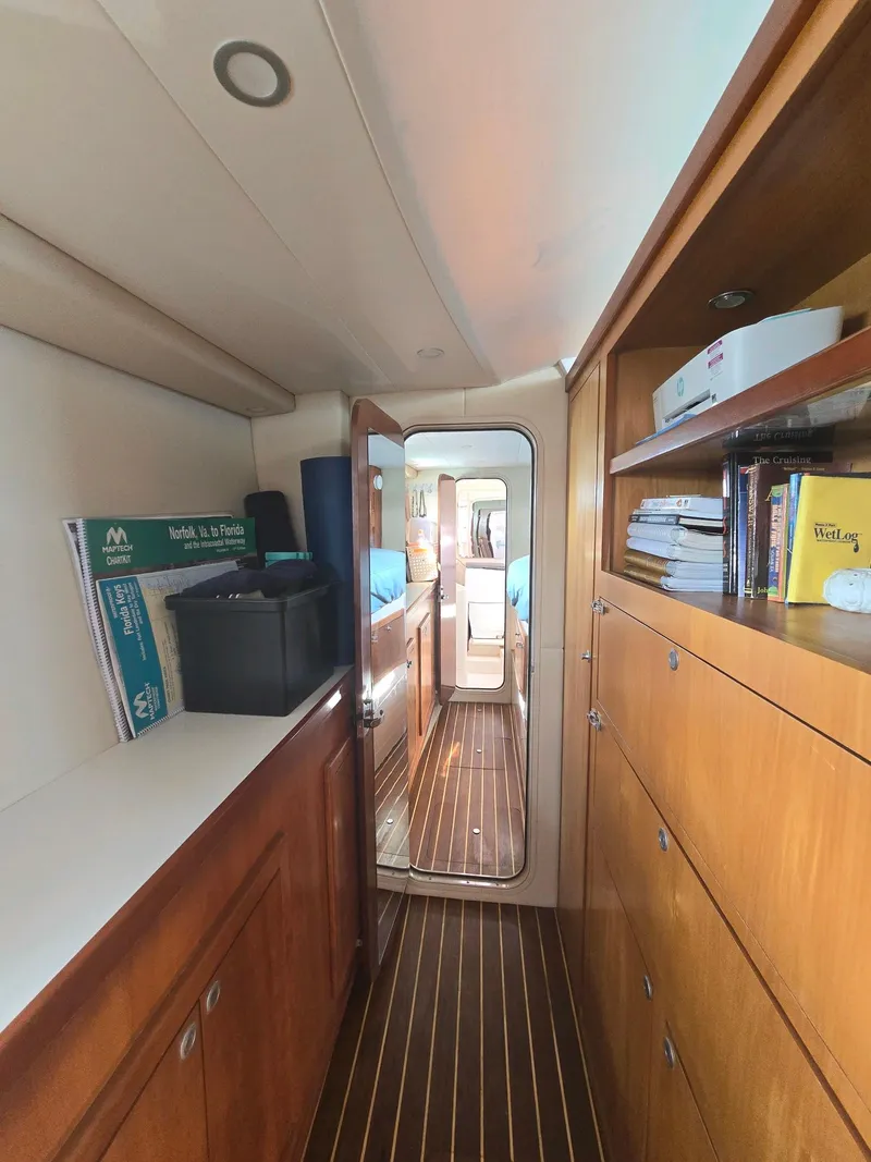 Slide: The Image of Interior of 2009 Fusion 40 yacht with wooden cabinetry and hallway view. - 20