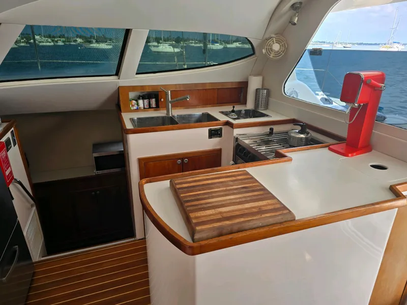 Slide: The Image of 2009 Fusion 40 yacht kitchen with modern appliances and ocean view. - 22