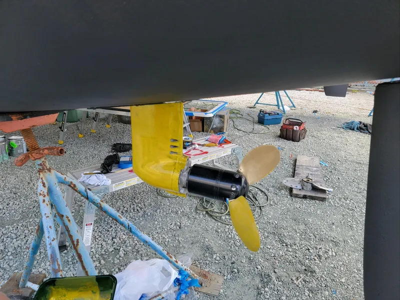 Slide: The Image of Yellow propeller on a 2009 Fusion 40 boat, under maintenance. - 26