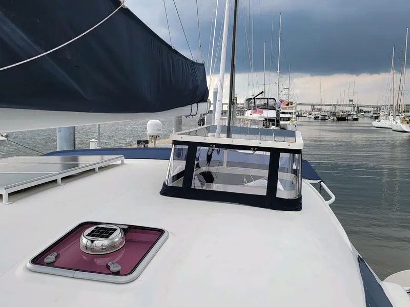 Slide: The Image of 2009 Fusion 40 sailboat docked in marina, overcast sky. - 29