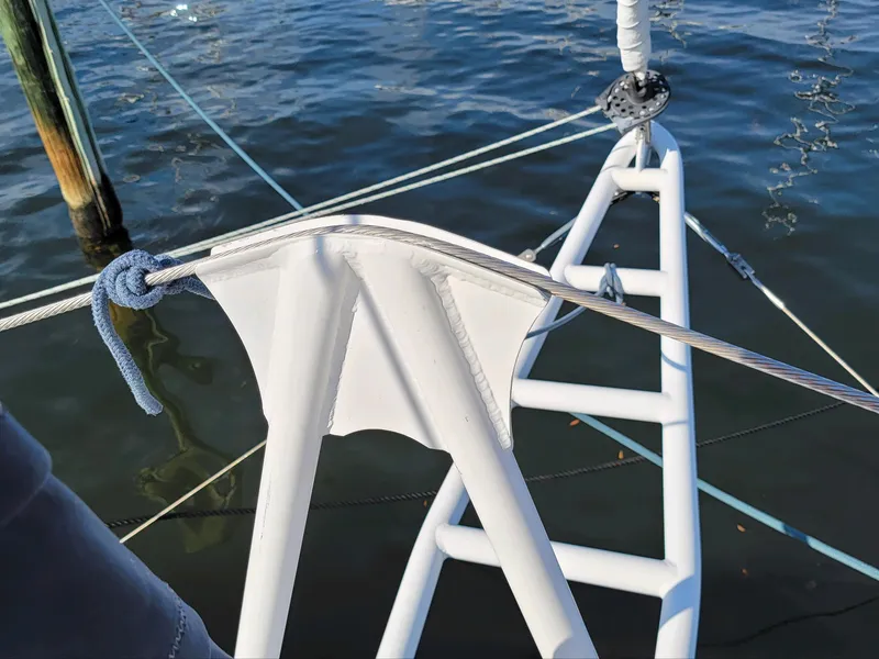 Slide: The Image of Sailboat rigging detail on 2009 Fusion 40, docked on calm water. - 38