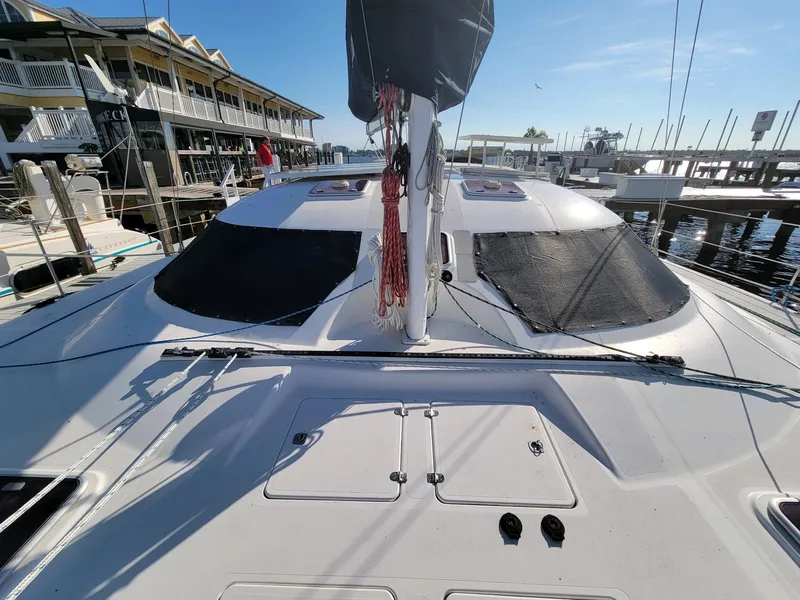 Slide: The Image of 2009 Fusion 40 catamaran docked at marina under clear blue sky. - 39