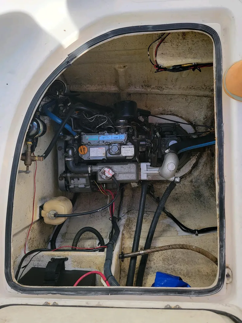 Slide: The Image of Engine compartment of a 2009 Fusion 40 boat, showing mechanical components and wiring. - 43