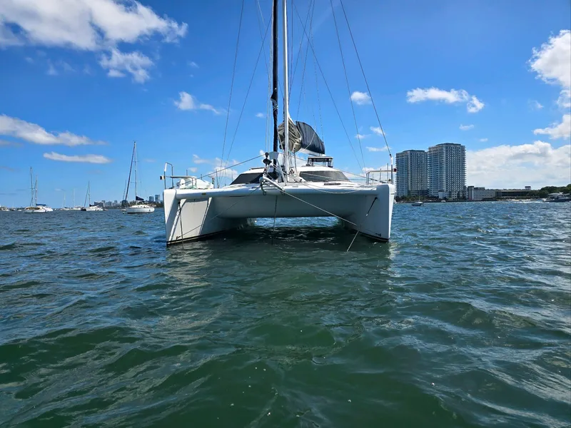 Slide: The Image of 2009 Fusion 40 catamaran sailing on a sunny day near city skyline. - 6
