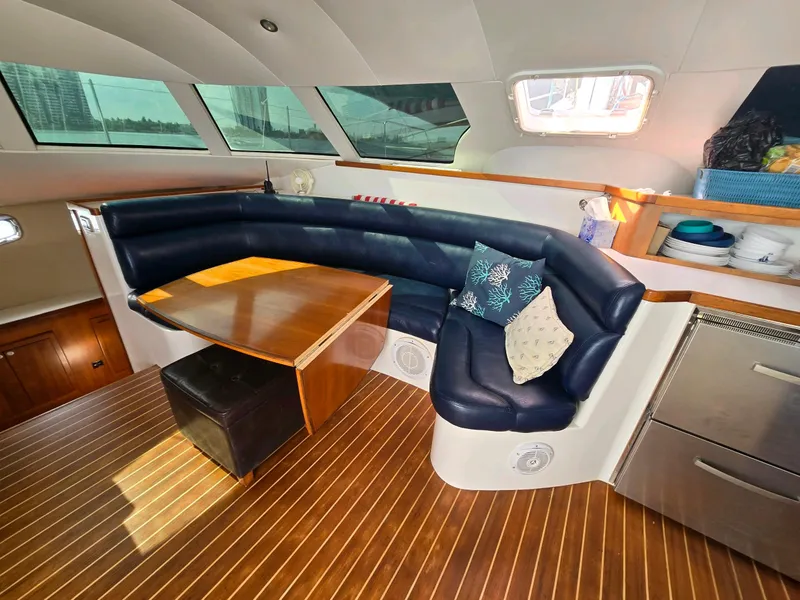 Slide: The Image of Luxurious 2009 Fusion 40 yacht interior with leather seating and wooden flooring. - 9
