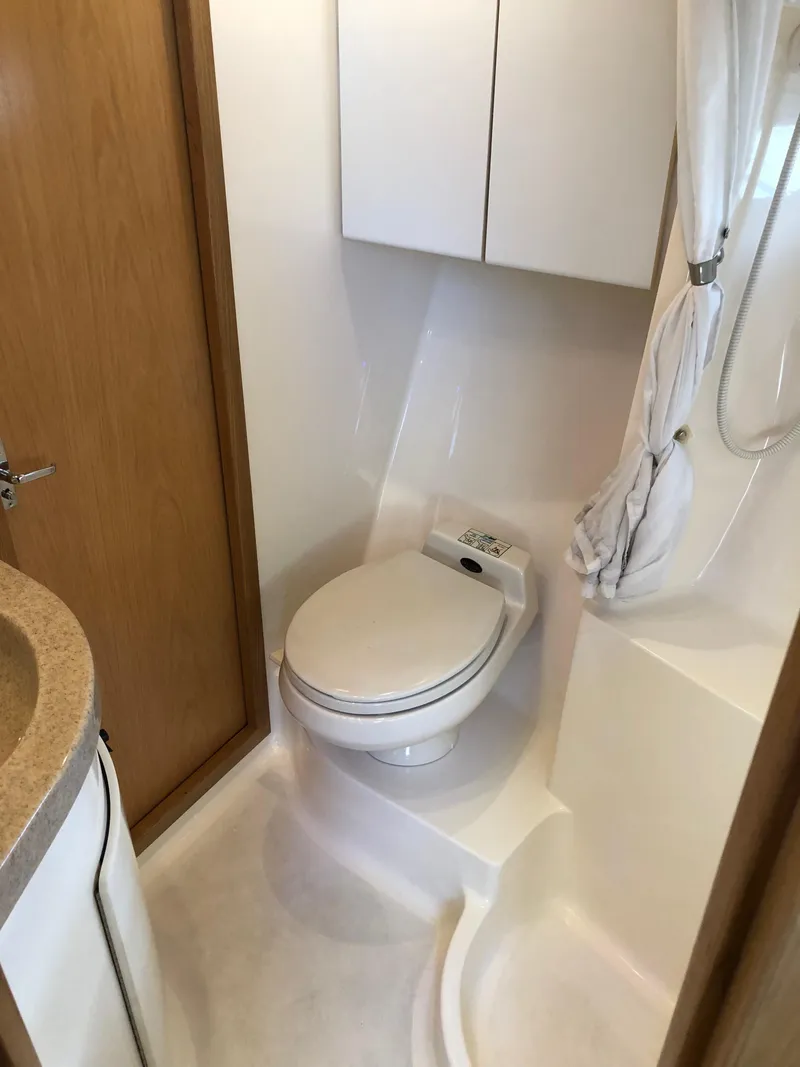 Slide: The Image of 1997 Tiara Yachts 3700 Open bathroom with toilet and shower. - 30