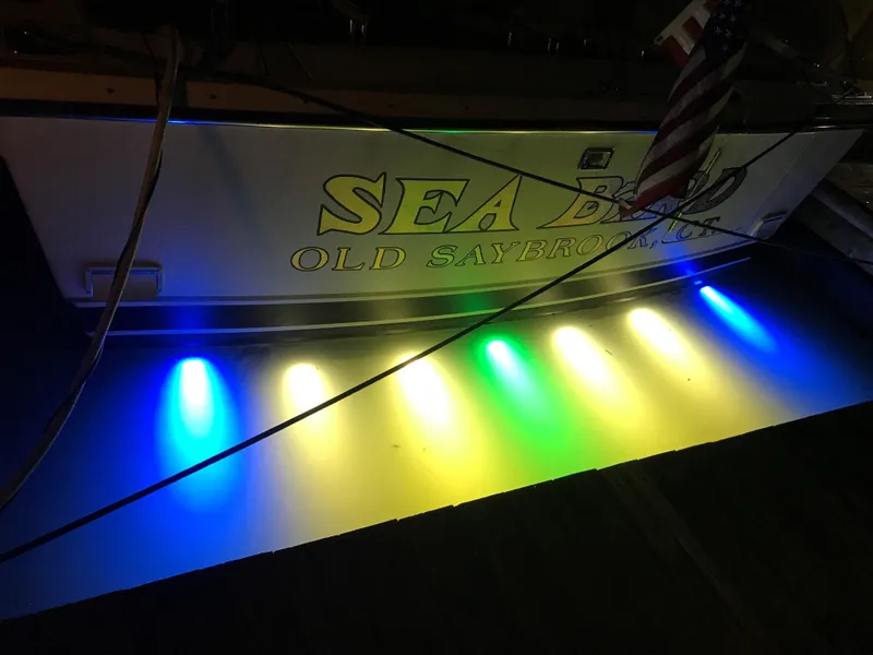 Slide: The Image of Tiara Yachts 1997 3700 Open with colorful underwater lights at night. - 31
