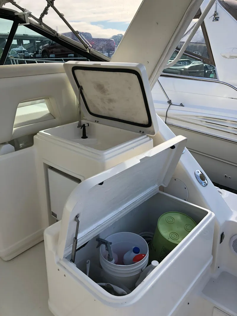 Slide: The Image of 1997 Tiara Yachts 3700 Open boat interior with storage compartments. - 7