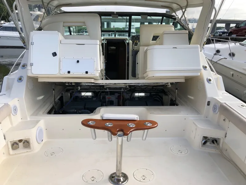 Slide: The Image of 1997 Tiara Yachts 3700 Open boat interior with seating and storage compartments. - 8