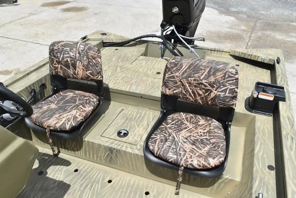 Slide: The Image of 2024 Tracker Grizzly 1754 SC boat with camo seats and steering console. - 24