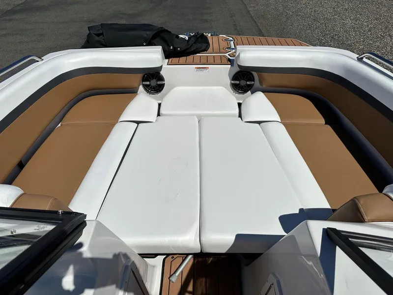 Slide: The Image of 2024 Starcraft SVX 190 OB DC boat interior with white and tan seating. - 6