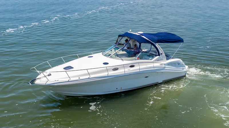 Slide: The Image of 2005 Sea Ray 340 Sundancer cruising on open water. - 10