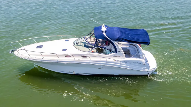 Slide: The Image of 2005 Sea Ray 340 Sundancer cruising on calm waters. - 16