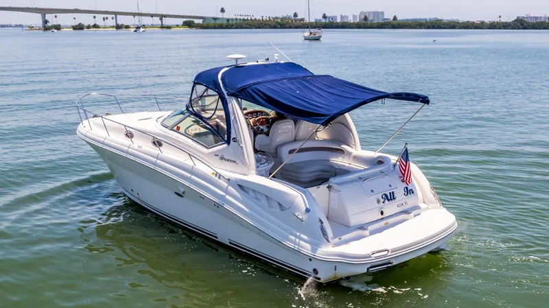 Slide: The Image of 2005 Sea Ray 340 Sundancer boat cruising on calm waters. - 17
