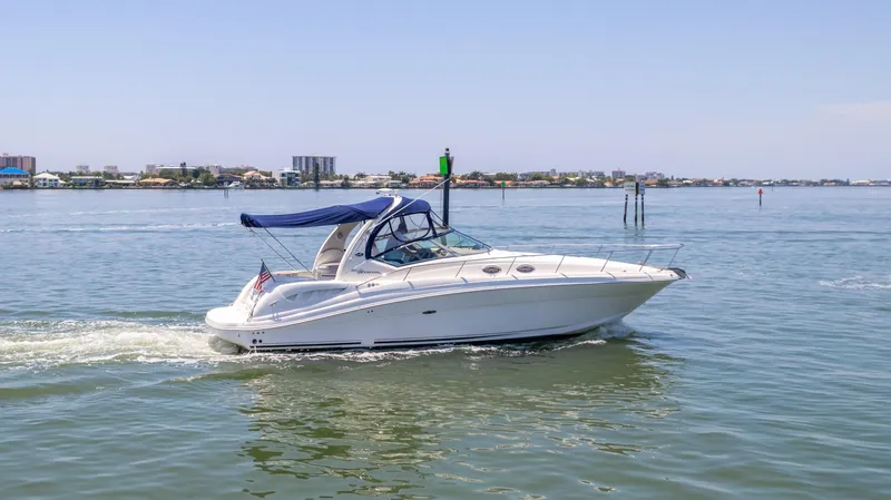 Slide: The Image of 2005 Sea Ray 340 Sundancer cruising on calm waters. - 2