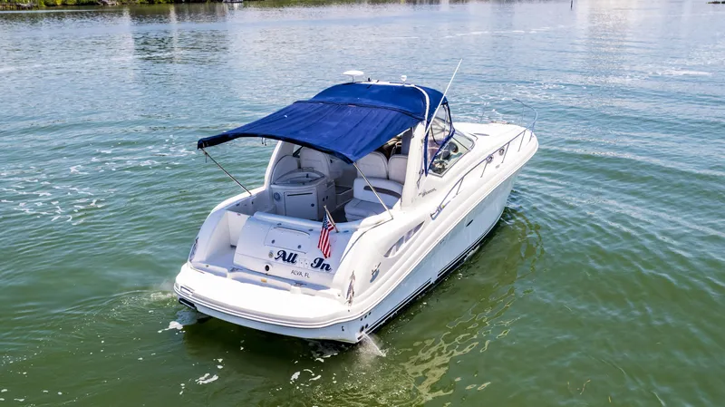 Slide: The Image of 2005 Sea Ray 340 Sundancer boat cruising on calm water. - 20