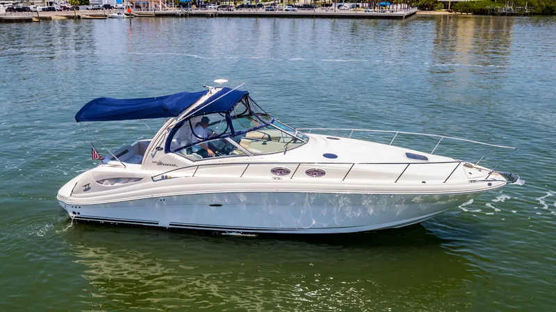 Slide: The Image of 2005 Sea Ray 340 Sundancer cruising on calm waters. - 25